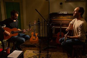 Brad Myrick playing acoustic guitar