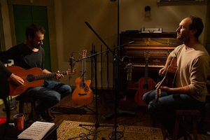 Brad Myrick playing acoustic guitar