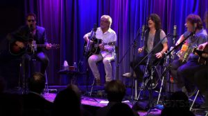 Foreigner playing acoustic on stage